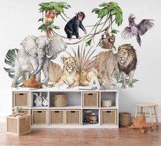 an animal mural on the wall of a children's room with various animals and plants