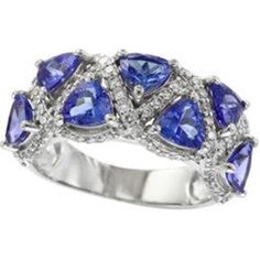 Uncover the utopia of uniqueness with the 14K EFFY White Gold Tanzanite Trillion Band, a celestial marvel destined to grace your finger with ethereal elegance. Adorned with a mesmerizing trillion-cut tanzanite, this band exudes a mystical allure, capturing the essence of twilight skies and starlit dreams. Embraced by the lustrous glow of 14K white gold, every facet of this enchanting gemstone dances with the light, casting a spell of enchantment upon all who behold it.With a total carat weight of 3.19, the tanzanite gemstone is a captivating centerpiece, radiating hues of violet-blue that evoke the depths of an ocean at dusk. Delicately nestled alongside are sparkling diamonds, totaling 0.68 carats, like shimmering stars adorning the heavens. Designed by the renowned house of EFFY, this ba Ethereal Elegance, Twilight Sky, Tanzanite Gemstone, Timeless Treasures, Love Symbols, Sparkle Diamonds, Estate Jewelry, The Ordinary, Types Of Metal