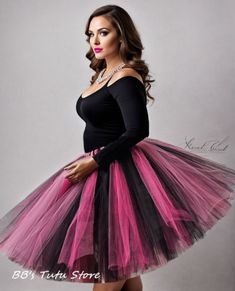 Make a statement and capture everyone's attention with this eye-catching Black, Shocking Pink, and Fuchsia Tutu Skirt. Designed to impress, this vibrant skirt is meticulously crafted by tying strips of tulle onto a highly stretchy elastic band, ensuring a comfortable and secure fit for all-day wear. Whether you're planning a family photoshoot, celebrating a birthday party, enjoying holidays, or simply seeking to add a touch of whimsy to your day, this tutu skirt is the perfect choice. Its vibrant colors of black, fuchsia, and shocking pink create a visually stunning contrast that will make you stand out from the crowd. For sizes 14 and above, this tutu skirt is 20 inches long, allowing for graceful movement and showcasing its vibrant colors. For smaller child sizes, the skirt is tailored t Pink Fitted Skirt For Costume Party, Fitted Pink Skirt For Costume Party, Pink Skirt For Spring Costume Party, Pink Mini Skirt For Costume Party, Pink Fitted Full Mini Skirt, Pink Stretch Full Skirt, Multicolor Tiered Mini Skirt For Party, Graceful Movement, Black Tutu