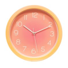 a yellow and pink clock with numbers on the face against a white background that reads 11 55