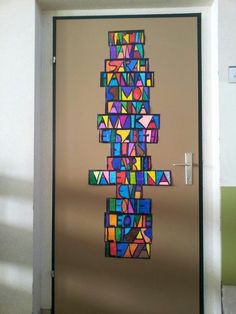 a door decorated with multicolored letters and numbers