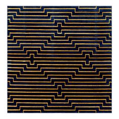 a black and gold area rug with lines on it