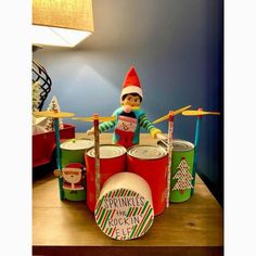 an elf is playing drums on the table