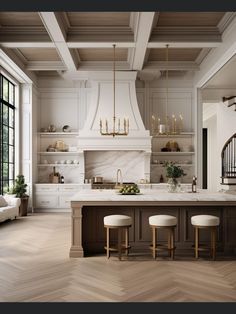 a large kitchen with white cabinets and wooden floors