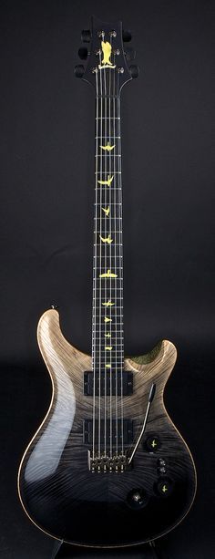 an electric guitar sitting on top of a table