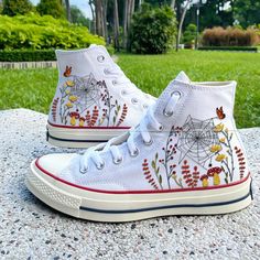 🌿 Love Embroidered Converse 🌿 ❤️ About Our Products: Each pair of shoes from our store is brand new and hand-embroidered to order. Please ensure you select the correct shoe size before checkout. The embroidery is durable and won't fade over time. ✨ Personal Expression: Showcase your unique style with custom embroidery! Contact me to create your own embroidered shoes with a private listing. I'll send you the design for approval before embroidering the shoes. Alternatively, you can design your p Casual Sneakers With Multicolor Embroidery And Appliques, White Cotton Sneakers With Floral Embroidery, Casual Custom Embroidery Lace-up Sneakers, Casual Embroidered Closed Toe Sneakers, Lace-up Sneakers With Multicolor Embroidery And Embroidered Logo, Multicolor Embroidered Lace-up Sneakers, High-top Embroidered Multicolor Sneakers, White High-top Sneakers With Floral Embroidery, High-top Multicolor Embroidered Sneakers