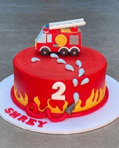 a birthday cake with a fire truck on top