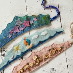 three handmade hair clips with stars and clouds on them