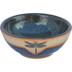 a blue and orange bowl with a dragonfly on it