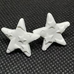 "Star polymer clay earrings.  4 Different Options: Large star painted with copper acrylic paint 1.5\" wide Large star with rough texture in white 1.5\" wide Medium star with rough texture in white 1\" wide Small star with star imprint in white .75\" wide Handmade earrings using polymer clay. Lightweight and easy to wear. Post: Stainless steel push back post, Nickel-free Material: Baked Polymer Clay All my products are handmade. There will be a slight variation in dimensions and color. Item pictured may not be the exact item you will receive but it will be similar with a slight variation in the pattern or texture. Please remove earrings before showering or swimming.  Polymer clay earrings are very strong and flexible however they can break. Do not bend your earrings, please handle with care White Star-shaped Earrings With Star Charm, White Star Charm Earrings As Gift, White Star-shaped Earrings As Gift, Star Polymer Clay, Girls Camp Crafts, Camp Crafts, Earrings Star, Star Stud Earrings, Rough Texture