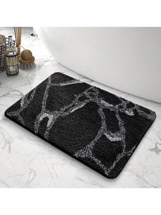 a bathroom rug with an image of a man on the bathtub in black and white