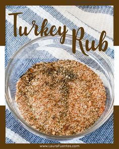 a glass bowl filled with spices on top of a blue and white towel