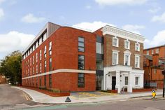 a red brick building sitting on the corner of a street