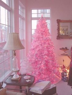 a pink christmas tree in a living room