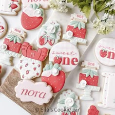 some decorated cookies are sitting on a table