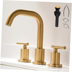 two faucets on a white counter top next to a black and gold faucet