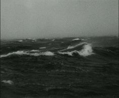 black and white photo of waves in the ocean