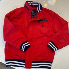 Us Polo Windbreaker. Size Child Large. Brand New Never Worn. $15 Red Outerwear For School In Fall, Casual Red Outerwear For Cold Weather, Sporty Red Outerwear For School, Red Sporty Outerwear For School, Red Casual Outerwear For School, Red Cotton School Outerwear, Red Winter Outerwear For School, Red Hooded Outerwear For School, Red Cotton Outerwear For School