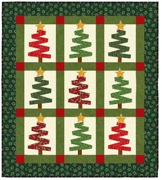 a quilted christmas tree with stars on it