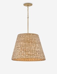 a light fixture with a woven shade hanging from it's side, against a white background