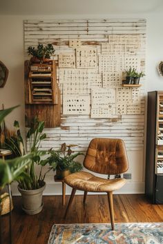 Cozy room with a leather chair, plants, and a wall decorated with vintage sheet music. Rustic Interior Wall Ideas, Vision Board Wall, Unique Wall Decor Ideas, Large Wall Decor Ideas, Creative Wall Decor Ideas, Stylish Wall Decor, Wall Decoration Ideas, Interactive Walls, Trendy Wall Decor