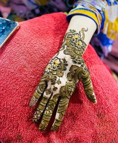 a henna on someone's arm and hand