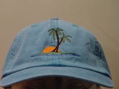 NEW EMBROIDERED PALM TREE SUNSET OCEAN WILDLIFE BASEBALL HAT (HATS PICTURED ARE CARIBBEAN BLUE, NAVY BLUE, KHAKI, WHITE, BURGUNDY AND CHARCOAL) Adams Optimum 6 Panel Baseball Hat Low Profile - 100% Cotton Twill Adult Cap Pigment Dyed - Garment Washed Hat 6 Panels with Sewn Matching Eyelet Visor with 3 Rows of Stitching Pre-formed Bill - Leather Strap with Brass Grommet Adjustable - One Size Fits Most An Extremely Comfortable Baseball Hat! Enjoy the Embroidered Palm Tree Sunset Ocean Wildlife Hat Adjustable Beach Baseball Cap With Embroidered Logo, Casual Beach Hats With Embroidered Logo, Casual Beach Hat With Embroidered Logo, Casual Vacation Hats With Embroidered Logo, Casual Embroidered Hats For The Beach, Casual Embroidered Beach Hats, Casual Embroidered Baseball Cap For Beach, Six-panel Baseball Cap For Beach And Summer, Summer Beach Dad Hat With Embroidered Logo