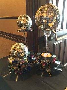 three disco balls on top of a table