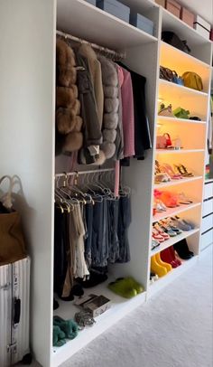 the closet is full of clothes and shoes for all kinds of people to use it