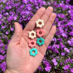 April showers really do bring May flowers. These adorable lightweight 3 tier flowers are perfect for your summer or spring outfit. These earrings are bright and beautiful.  All earring backs are hypoallergenic stainless steel studs that are nickel free. They're superglued and then covered with resin for extra strength.  All earrings are handmade in small batches. Slight differences and imperfections are to be expected, where they're all handmade art.  So actual item you receive could or will dif Pastel Earrings, Earrings Polymer, Earrings Clay, Spring Earrings, Dog Earrings, Earrings Summer, Summer Earrings, Retro Earring, Daisy Earrings