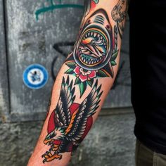 a man with a tattoo on his arm and an eagle in the middle of it