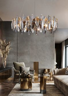 a living room with a couch, chair and chandelier hanging from the ceiling