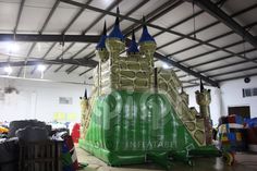 an inflatable castle is set up inside a warehouse