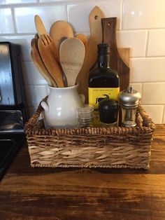 kitchen utensils in a wicker basket on the counter