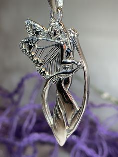 "Solid sterling silver on a silver chain -- Legends whisper that the fairies live within the wild woods among the ocean of lavender and blue daisies. Their roots buried deep within Celtic Britain where the lore of their existence seep across the land. Ruins hum to the rhythmic movement of their wings, traveling through the earth's veins- into the fairy pools of silken blue. Faeries are creatures of the forest and of nature. If they are treated with respect, they can and will help anyone. Faeries Blue Daisies, Fairy Pools, Jewelry Butterfly, Elven Jewelry, Fantasy Gifts, Wiccan Jewelry, Fairy Necklace, Butterfly Fairy, Irish Jewelry