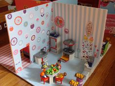 a doll house with lots of furniture and accessories