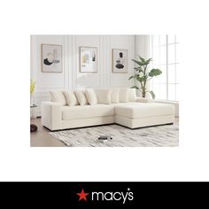 a white sectional sofa with pillows on it