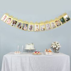 a white table topped with cake and pictures