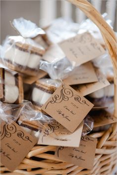 a wicker basket filled with lots of cookies and small tags attached to the top