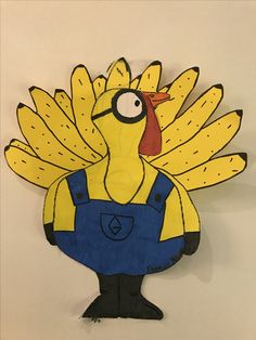 a paper cut out of a cartoon character wearing overalls and a bird like head