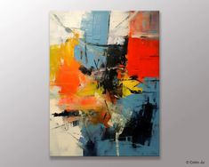 an abstract painting with blue, red and yellow colors on it's canvases