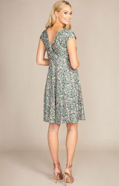 Our Alessandra maternity dress is a trusted favourite Tiffany Rose design. Now introducing our summer sage-green ditsy floral print. Breastfeeding friendly cross-over neckline, grown-on sleeves for that extra upper arm coverage and a full swishy skirt that falls to the knee. This maternity style is perfect for every event, from brunch with friends to wedding guest chic. Ditsy floral print in olive/sage green with flecks of orange and pink detail Soft premium stretch jersey fabric / Cross-over ne Green Short Sleeve Maternity Dress For Summer, Green V-neck Maternity Dress, Spring V-neck Nursing Friendly Maternity Dress, Spring Maternity Dress With Nursing Friendly V-neck, Spring Maternity Dress V-neck Nursing Friendly, Fitted Green Maternity Dress With Short Sleeves, Green V-neck Maternity Dress For Summer, Green Short Sleeve Maternity Dress, Casual Green Maternity Dress