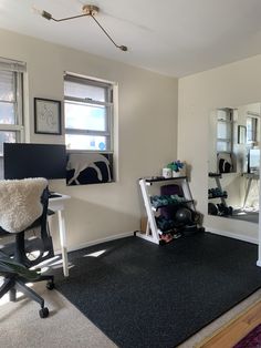 a room with a chair, mirror and other items on the floor in front of it