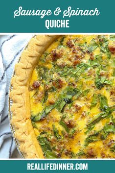 a quiche with spinach, sausage and spinach on top in a pie pan