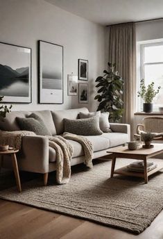 a living room filled with lots of furniture and pictures on the wall above it's windows