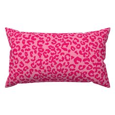 a pink leopard print pillow on a white background