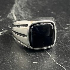 Mens Square Black Onyx Gemstone Silver Ring , Men Silver Onyx Stone Ring , Handmade Vintage Jewelry , 925 Sterling Silver Jewelry , Gift For Him , Same Day For Shipping ✧ Product Details * Handmade İtem * Gender : Male / Female * Material : 925K Sterling Silver * Ring Weight : 9.5 Grams * Gemstone Type : Black Onyx ✔ Usage Details * Silver jewelry is very sensitive to chemicals. It is recommended to keep away from chemical substances such as cream, bleach, deodorant, detergent. * Silver jewelry can also darken quickly in salt water, that is, in sea water. For this reason, it is best to remove them when swimming in the sea. ✔ Shipping * Your orders placed on weekdays are delivered to the cargo on the same day. Your orders placed on the weekend are delivered to the cargo on Monday. ✔ Other D Black Stainless Steel Ring With Polished Finish, Classic Black Adjustable Signet Ring, Formal Black Stainless Steel Signet Ring, Adjustable Black Signet Ring With Polished Finish, Modern Black Gemstone Signet Ring, Ring Men Silver, Silver Ring Men, Chemical Substances, Ring Men