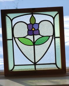 a stained glass window with a flower on it