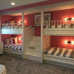 bunk beds with lights on each side and stairs to the second floor in a bedroom