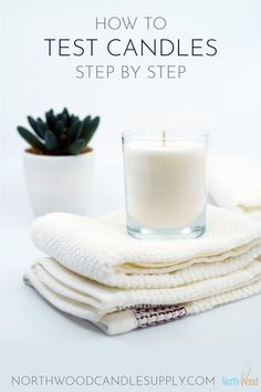 a stack of white towels next to a candle and succulent plant with text overlay how to test candles step by step